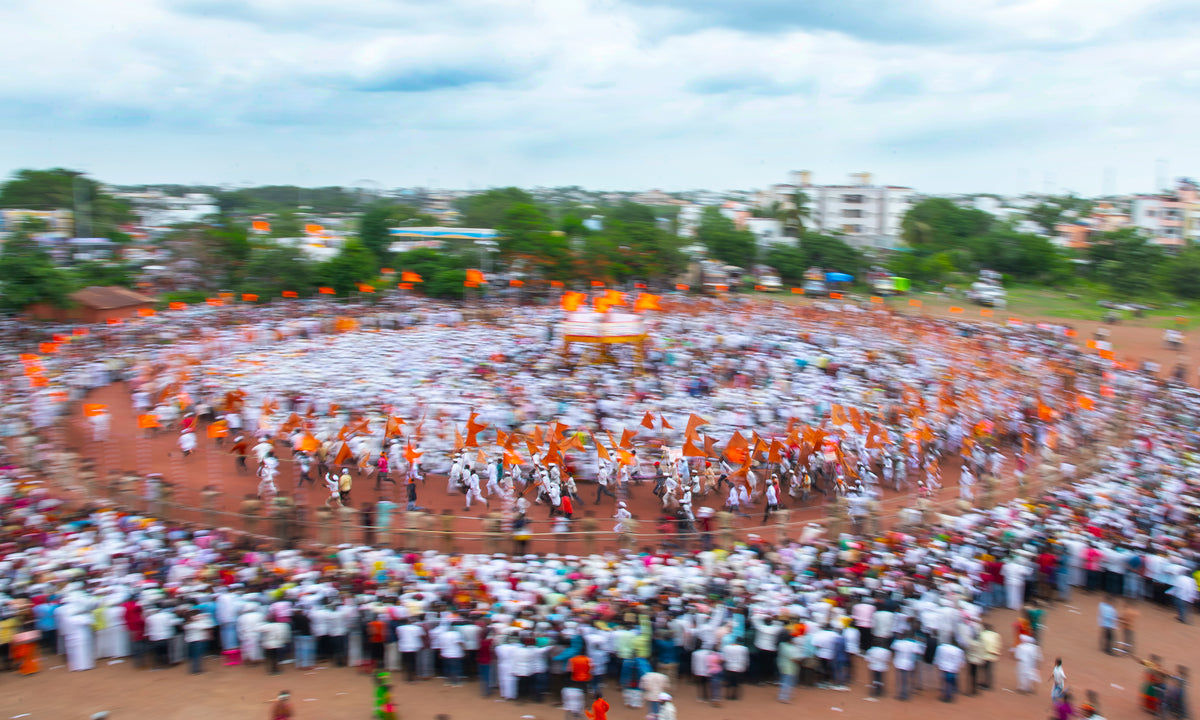 Devotees running with the flag